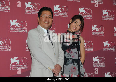 The president of the Studio Ghibli Koji Hoshino and Actress Miori Takimoto attends 'The Wind Rises' Photocall during the 70th Venice International Film Festival at the Palazzo del Casino on September 1, 2013 in Venice, Italy. Stock Photo