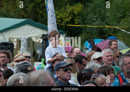 Balcombe, West Sussex, UK. 1st Sep, 2013. 'Belt it out Balcombe', Gathered crowds at this Anti Fracking singing event are  joined by Balcombe residents. The anti fracking environmentalists are protesting against test drilling by Cuadrilla on the site in West Sussex that could lead to the controversial fracking process. The roadside campsite continues to grow in size with more tents arriving daily Credit:  David Burr/Alamy Live News Stock Photo