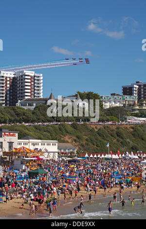 Bournemouth, UK Saturday 31 August 2013. A reported 404,000 people flocked to  the seaside to watch the third day of the Bournemouth Air Festival and enjoy the warm sunny weather. Red Arrows start the day Stock Photo