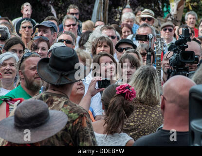 Balcombe, West Sussex, UK. 1st Sep, 2013. Carnival atmosphere at 'Belt it out Balcombe' event as the crowd listen to organiser Simon Welsh..  The anti fracking environmentalists are protesting against test drilling by Cuadrilla on the site in West Sussex that could lead to the controversial fracking process. The roadside campsite continues to grow in size with more tents arriving daily Credit:  David Burr/Alamy Live News Stock Photo