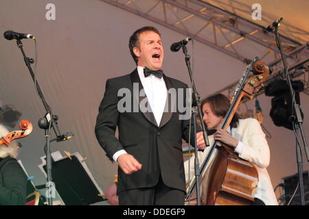 1 Sept 2013. Derby, UK. Award-winning baritone, Grant Doyle performs with the Sinfonia Viva orchestra at The Darley Park Concert.  Presented by Derby LIVE in partnership with the East Midlands Sinfonia Viva orchestra, Classic FM and Rolls Royce, The Darley Park Concert is one of the UK’s biggest outdoor classical concerts. © Deborah Vernon/Alamy Live News Stock Photo