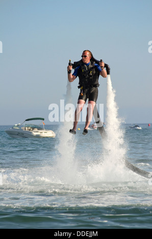 Jetlev, a personal flying machine flying based on a water-propelled jetpack near Marbella, Andalusia, Spain. Stock Photo
