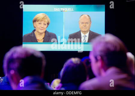 Berlin-Adlershof, Germany. 01st Sep, 2013. Guests watch the only TV election debate between German chancellor Angela Merkel (CDU) and Social Democratic Party top candidate Peer Steinbrueck at the TV studio in Berlin-Adlershof, Germany, 01 September 2013. Photo: MAURIZIO GAMBARINI/dpa/Alamy Live News Stock Photo