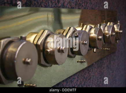 Row of fire department dry standpipes on city building Stock Photo