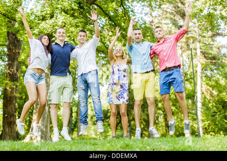 Teenagers jumps in the park Stock Photo