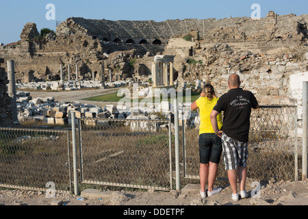 Tourists view the Roman Amphitheatre at Side, Turkey. Stock Photo