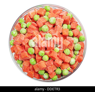 Frozen carrots and green peas in a glass bowl isolated on white. Top view Stock Photo