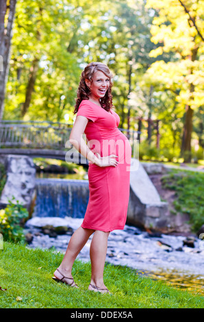 Pregnant woman in nature for a walk in the summer Stock Photo - Alamy