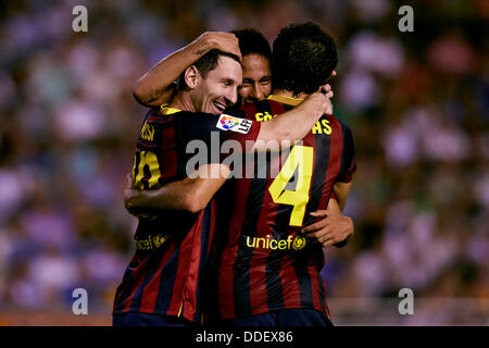 Valencia, Spain. 01st Sep, 2013. Forward Lionel Messi of FC Barcelona (L) celebrates with Forward Neymar of FC Barcelona (C) and Midfielder Cesc Fabregas of FC Barcelona after scoring his third goal during the Spanish La Liga game between Valencia and Barcelona from the Mestalla Stadium. Credit:  Action Plus Sports/Alamy Live News Stock Photo