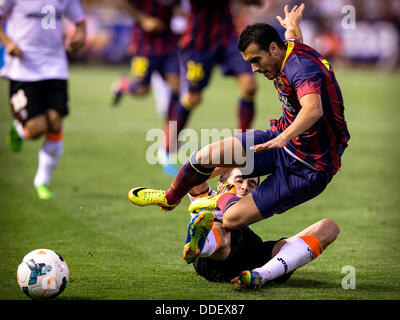 Valencia, Spain. 01st Sep, 2013. Pedro of FC Barcelona (UP) takes on Midfielder Michel of Valencia CF during the Spanish La Liga game between Valencia and Barcelona from the Mestalla Stadium. Credit:  Action Plus Sports/Alamy Live News Stock Photo