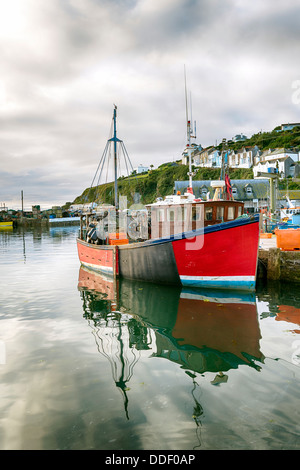 Old wooden fishing boat moored in Mevagissey harbour in Cornwall Stock Photo