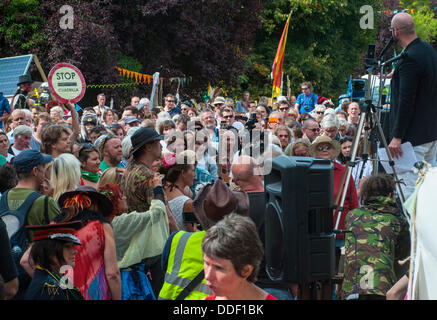 Balcombe,West Sussex, UK. 1st Sept, 2013.'Belt it out Balcombe'.  Event organiser Simon Welsh addresses the crowd... The anti fracking environmentalists are protesting against test drilling by Cuadrilla on the site in West Sussex that could lead to the controversial fracking process. The roadside campsite continues to grow in size with more tents arriving daily © David Burr/Alamy Live News Stock Photo