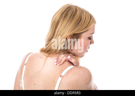 Model Released. Young Woman with a Stiff Neck Stock Photo