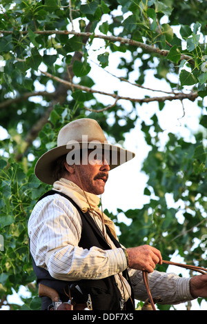 A cowboy fearfully riding his horse Stock Photo