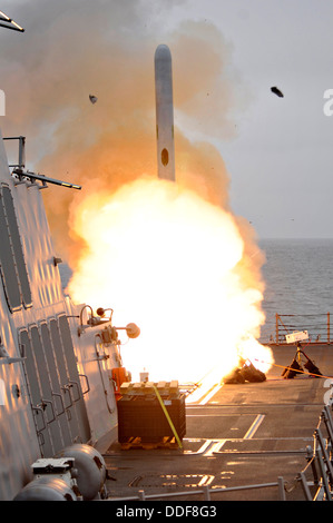 A tomahawk cruise missile launches off the guided-missile destroyer USS Sterett during training exercises June 22, 2010 off San Diego, CA. Stock Photo