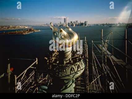 View of the torch platform of the Statue of Liberty looking east at New York harbor, Ellis Island and Lower Manhattan during restoration in 1984 on Liberty Island, NY. The restoration was undertaken for the centennial anniversary. Stock Photo