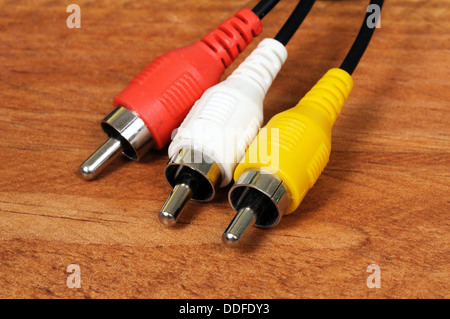 Phono plugs on a wooden background. Stock Photo