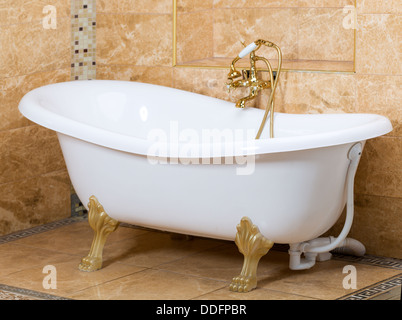 Interior of luxury bathroom with gold fittings Stock Photo