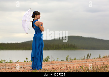 Beautiful dark haired model strolling through the woods. Fairy Tale setting Stock Photo