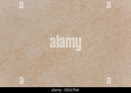close-up view of beige rough plaster wall Stock Photo