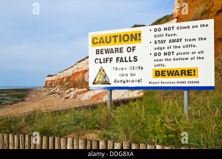 Erosion warning sign at the Coloured cliffs at Hunstanton North Norfolk coastal town England UK GB EU Europe Stock Photo
