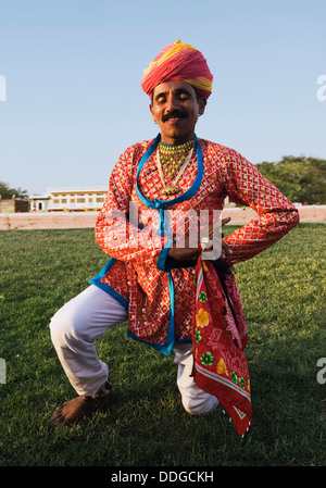 Portrait of a man dancing in traditional Rajasthani dress, Jaipur, Rajasthan, India Stock Photo