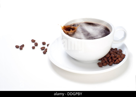 White Cup of Coffee with beans on a white isolated background. Stock Photo