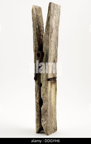 dirty old wooden clothespin on a white background Stock Photo