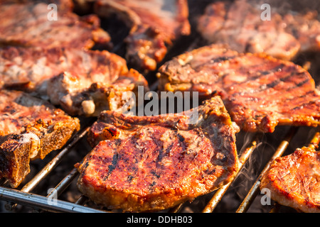 Closeup of steak on grill fire-toasted Stock Photo