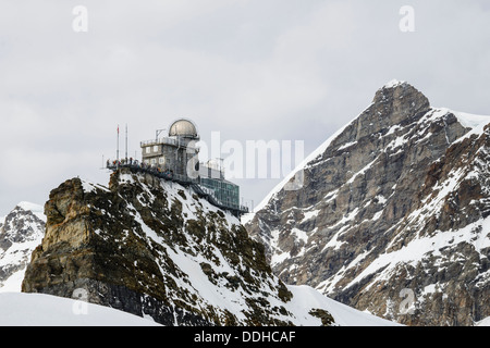 The Sphinx observatory at the Jungfraujoch near Grindelwald Switzerland with the Jungfrau a 4158 metre peak behind Stock Photo