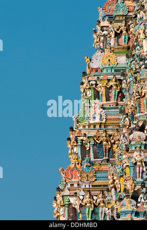 Colourful statues of gods and demons on the Gopuram or Gopura gate tower, Meenakshi Amman Temple or Sri Meenakshi Sundareswarar Stock Photo