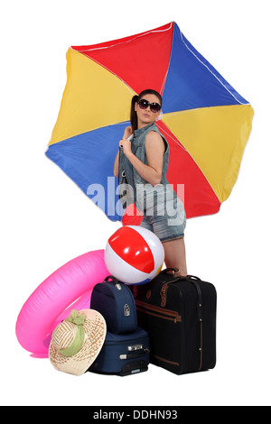 Woman leaving for a warmer climate Stock Photo