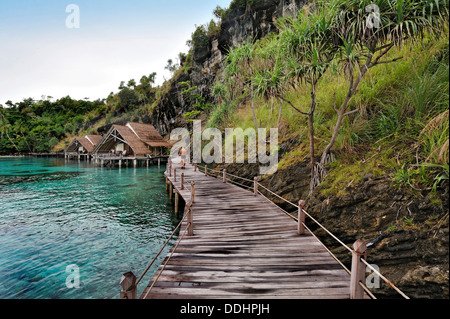 Wooden pier and water bungalows in a holiday resort Stock Photo