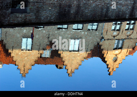 Guild houses with stepped gables being reflected in Dijver canal Stock Photo