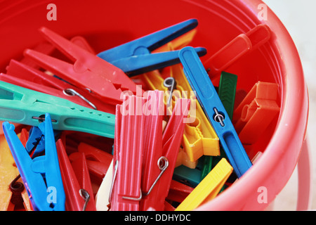 Colorful plastic clothespins in the bucket Stock Photo