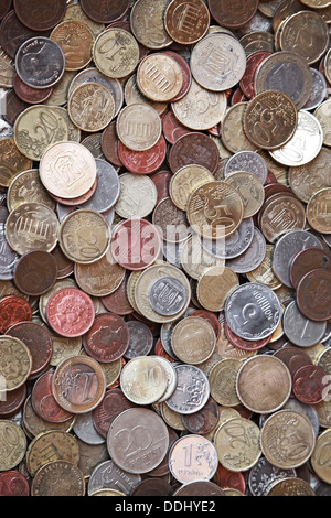 Vertical photo background with small coins of different European countries Stock Photo