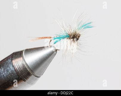 Hand tied fishing fly in clamp Stock Photo