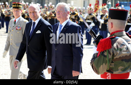 Paris, France. 03rd Sep, 2013. German President Joachim Gauck (R) is received with military honours by French Foreign Minister Laurent Fabius in Paris, France, 03 September 2013. The German head of state is in France for a three-day state visit. Photo: WOLFGANG KUMM/dpa/Alamy Live News Stock Photo