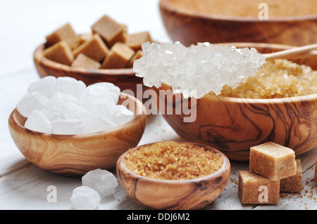 brown and white sugar in wooden bowls closeup Stock Photo