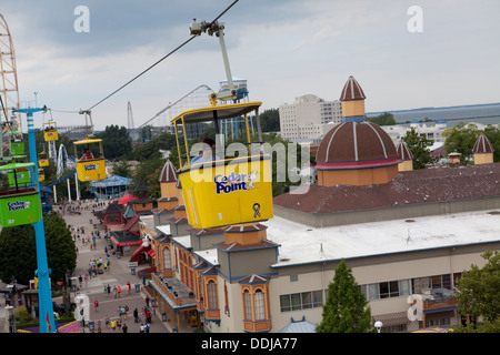 A man rides the Sky Ride at Cedar Point amusement park in Sandusky, Ohio Stock Photo