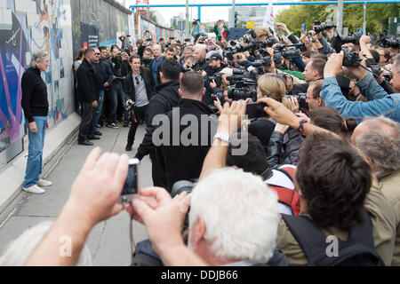 Berlin, Germany. 03rd Sep, 2013. Roger Waters (L), singer, bassist, composer, songwriter and former front man of British rock band Pink Floyd, visits the East Side Gallery in Berlin, Germany, 03 September 2013. Photo: MAURIZIO GAMBARINI/dpa/Alamy Live News Stock Photo