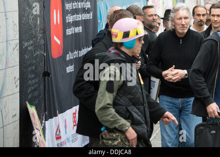 Berlin, Germany. 03rd Sep, 2013. Roger Waters (R), singer, bassist, composer, songwriter and former front man of British rock band Pink Floyd, visits the East Side Gallery in Berlin, Germany, 03 September 2013. Photo: MAURIZIO GAMBARINI/dpa/Alamy Live News Stock Photo