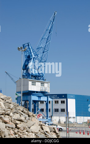 Old blue crane in the port of Malaga, Spain. Stock Photo