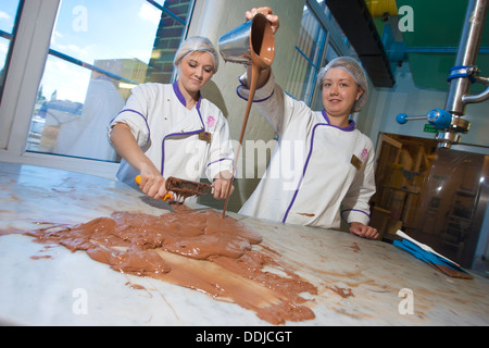 Workers at Cadbury World on the site of the Cadbury chocolate factory founded by George Cadbury in 1879, England, United Kingdom Stock Photo