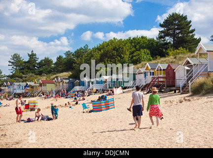 Busy Beach and beach huts at Wells next the sea North Norfolk coast England UK GB EU Europe Stock Photo