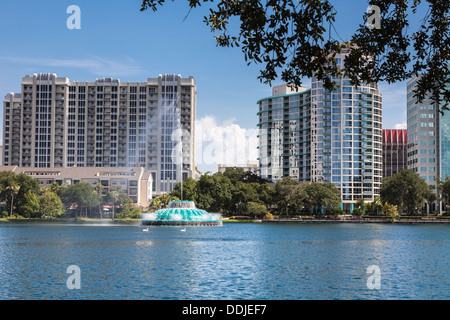 High rise buildings behind the fountain at Lake Eola in downtown Orlando Florida Stock Photo