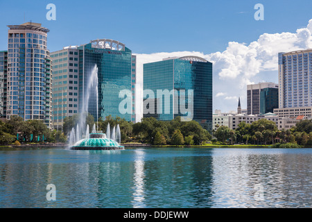 High rise buildings behind the fountain at Lake Eola in downtown Orlando Florida Stock Photo