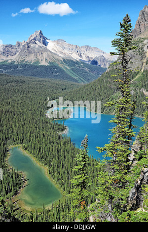 Mountains reflected in a clear calm alpine lake Stock Photo