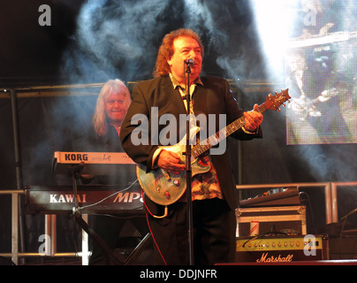 Bernie Marsden of Whitesnake at Silverstone 2013 British GP Grand Prix Woodlands stage with his guitar Stock Photo