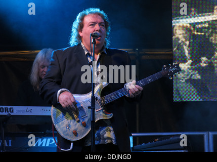 Bernie Marsden of Whitesnake at Silverstone 2013 British GP Grand Prix Woodlands stage with his guitar Stock Photo